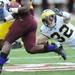 Michigan safety Jordan Kovacs looks to tackle a Minnesota ball carrier during the first quarter at TCF Bank Stadium in Minneapolis, Minn. on Saturday. Melanie Maxwell I AnnArbor.com